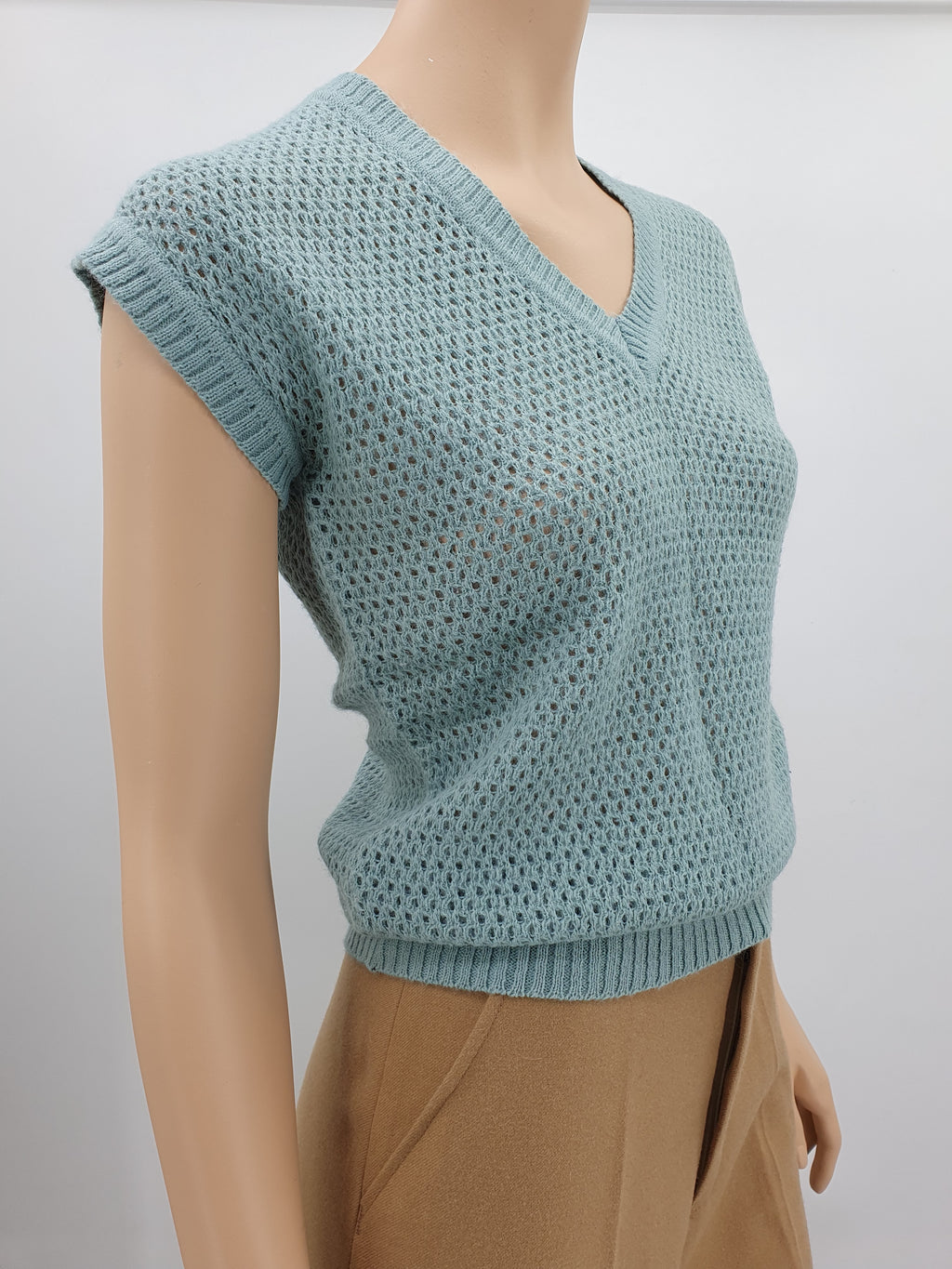 Light turquoise knitted vest, from the 70s-80s, size 36-38
