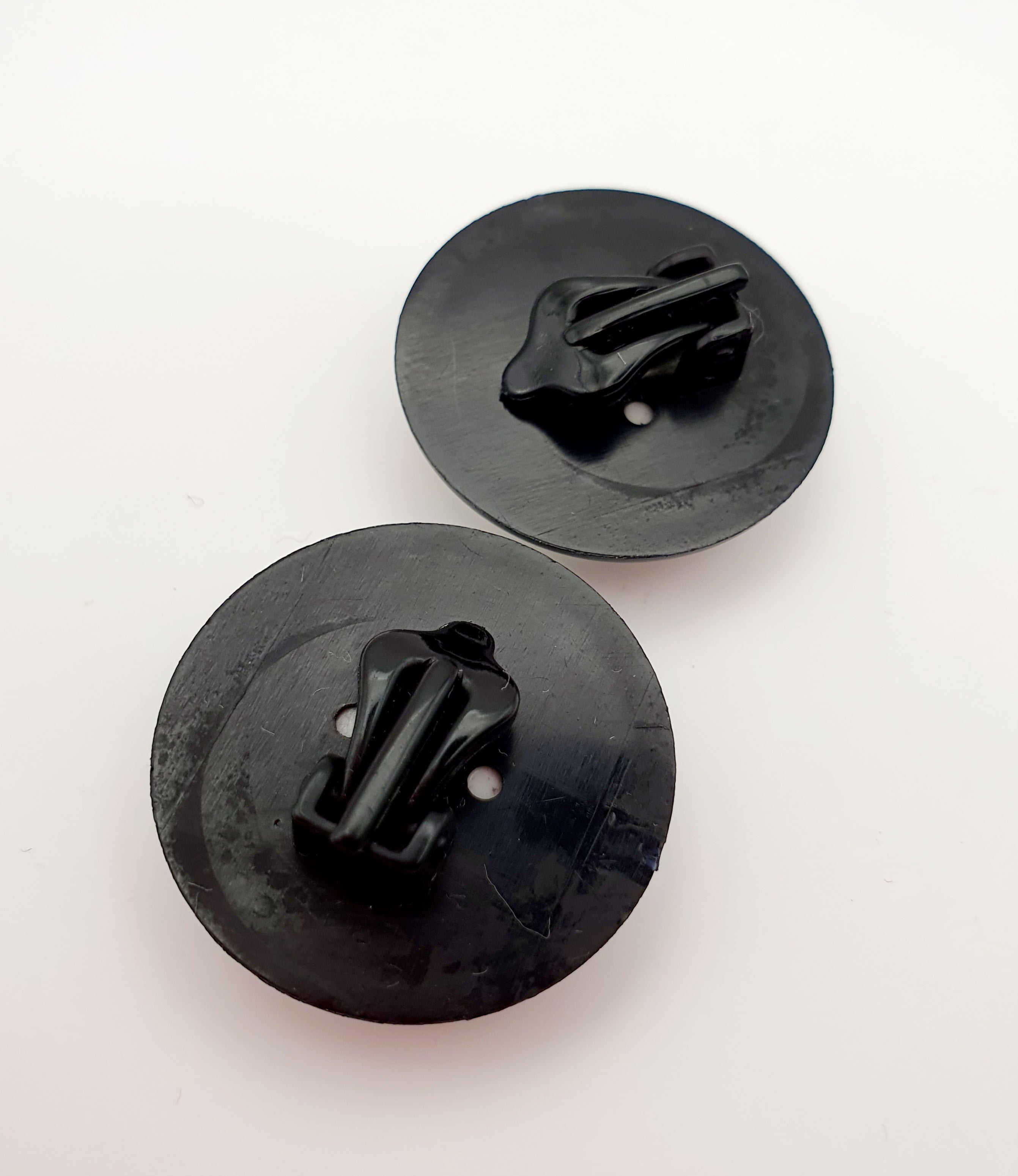 Clip-on earrings from the 80s, black and white