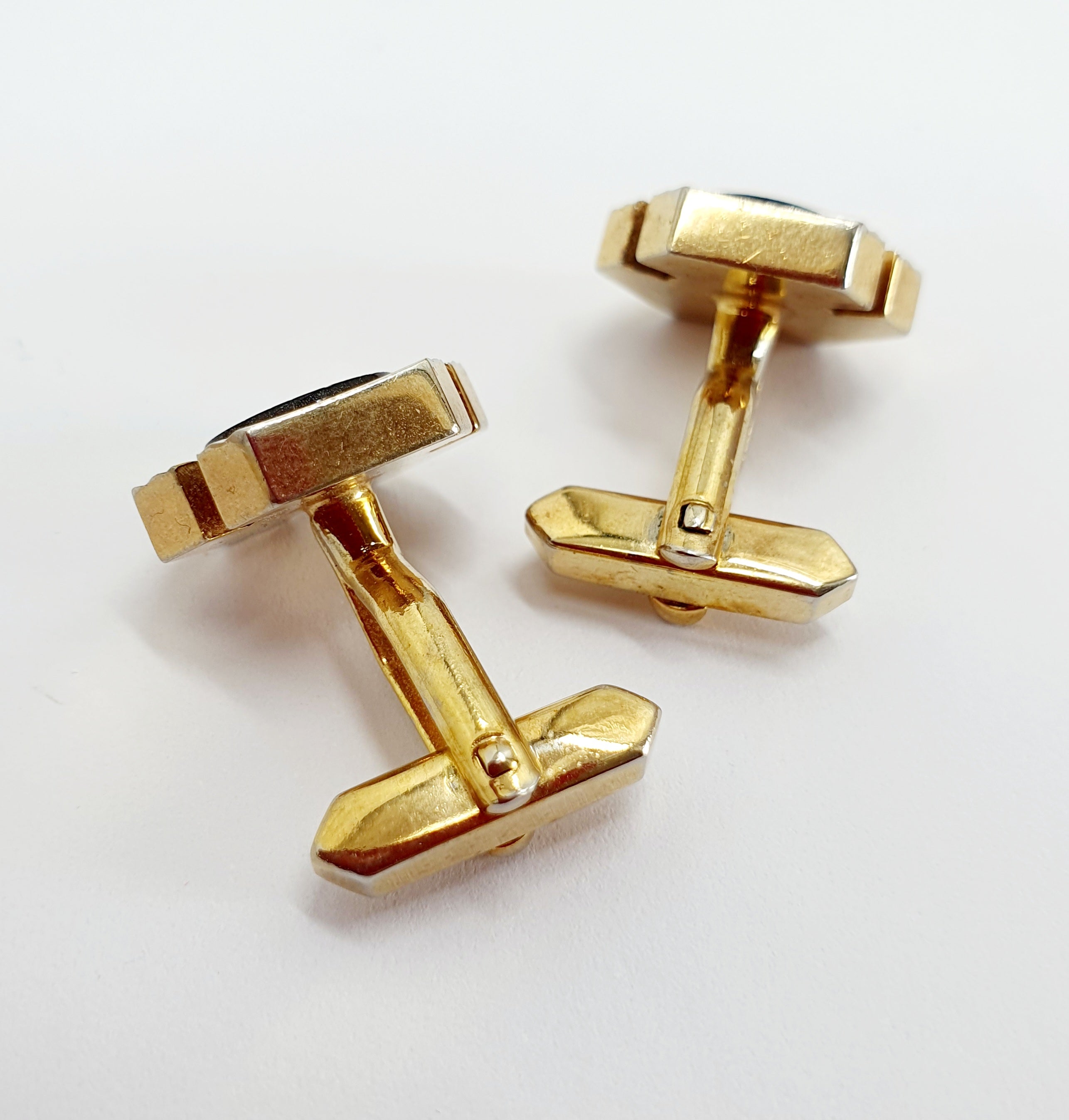Gold-colored cufflinks from the 60s-70s, round black center