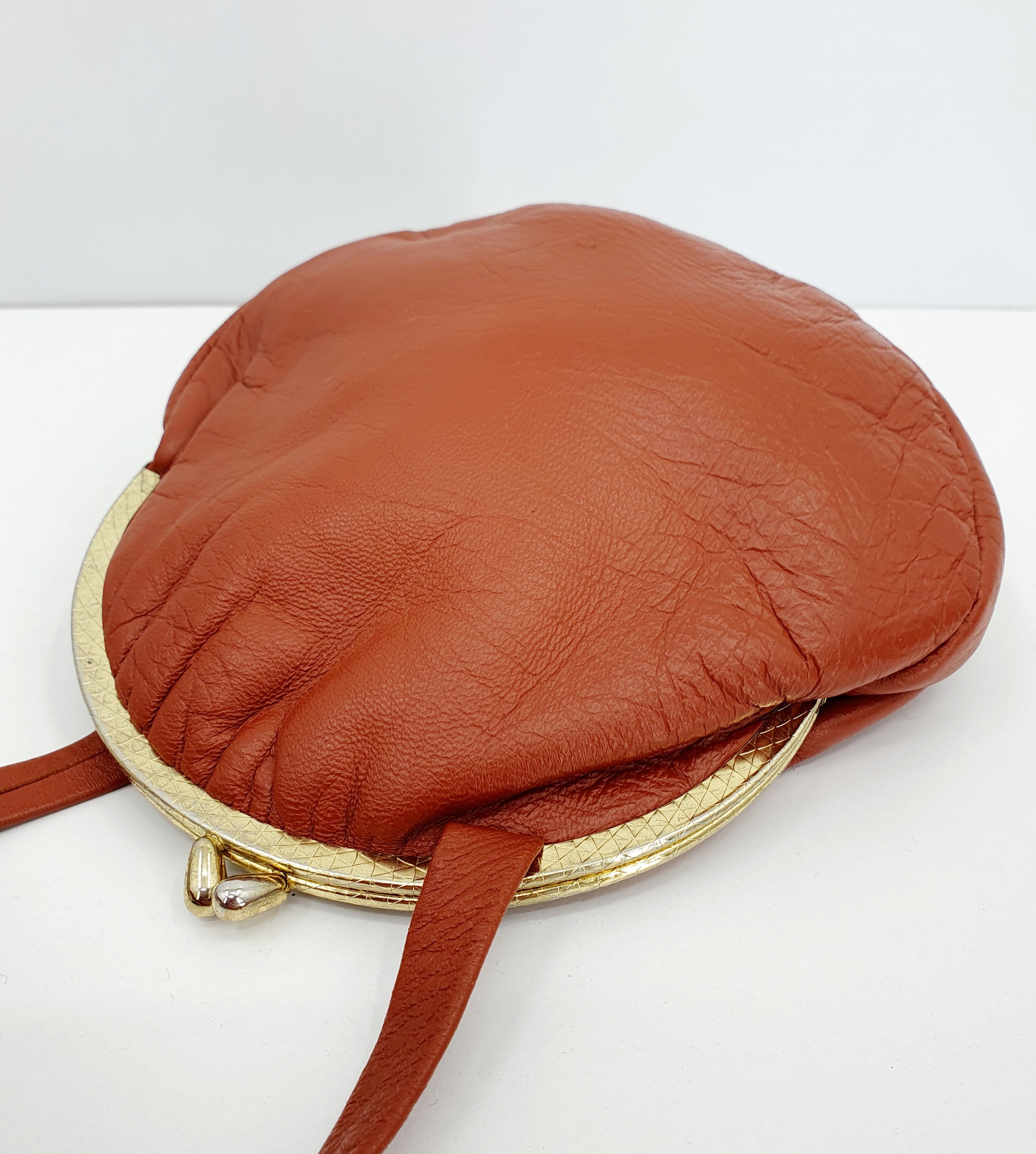 Burnt orange shoulder bag, 70s-80s, genuine leather