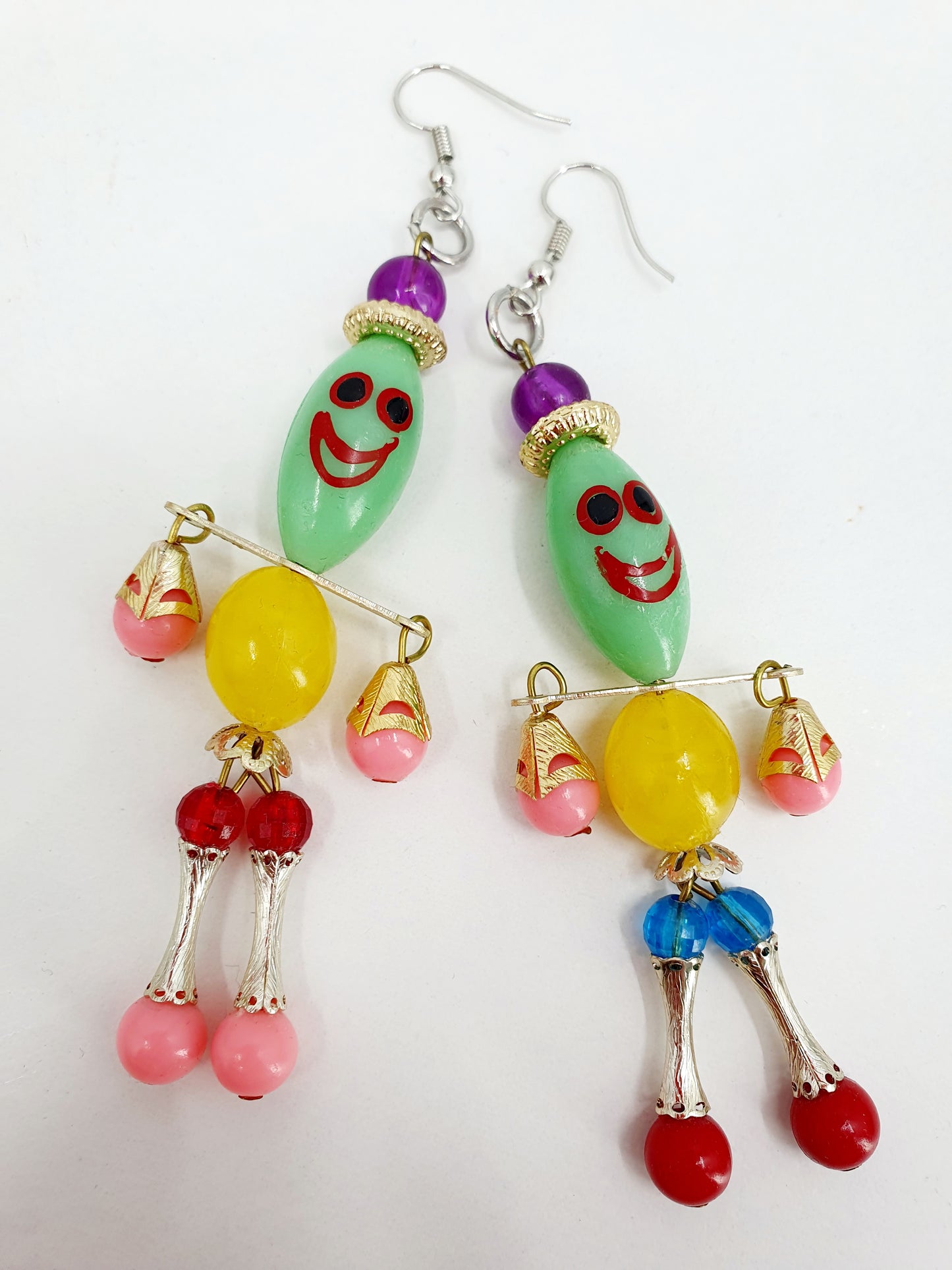 Earrings, two figures