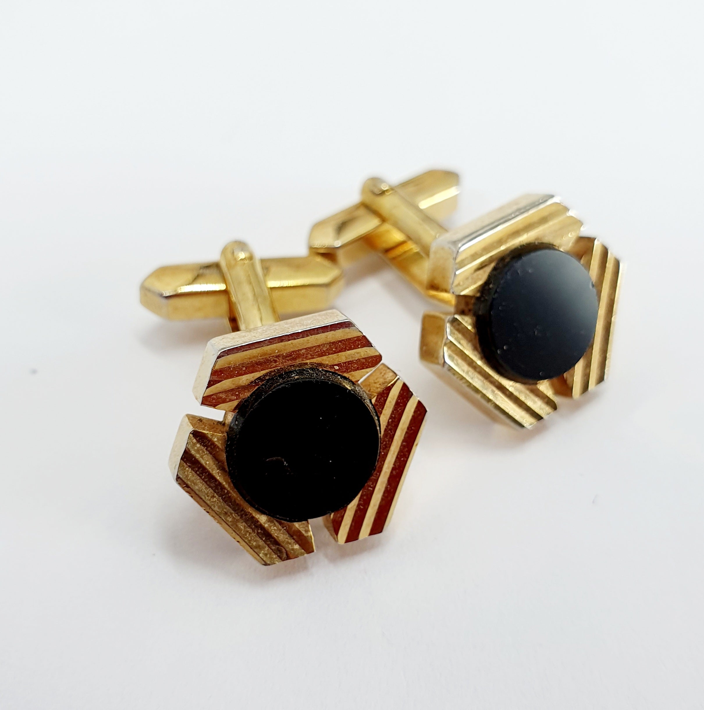 Gold-colored cufflinks from the 60s-70s, round black center