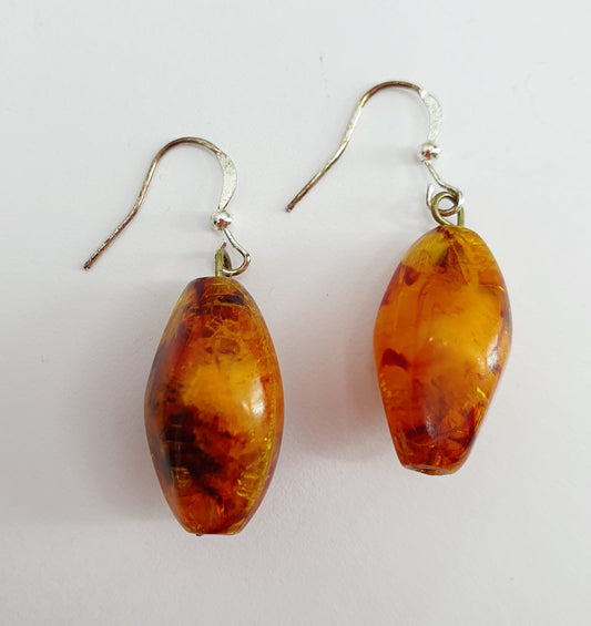 Earrings, amber colored pendant