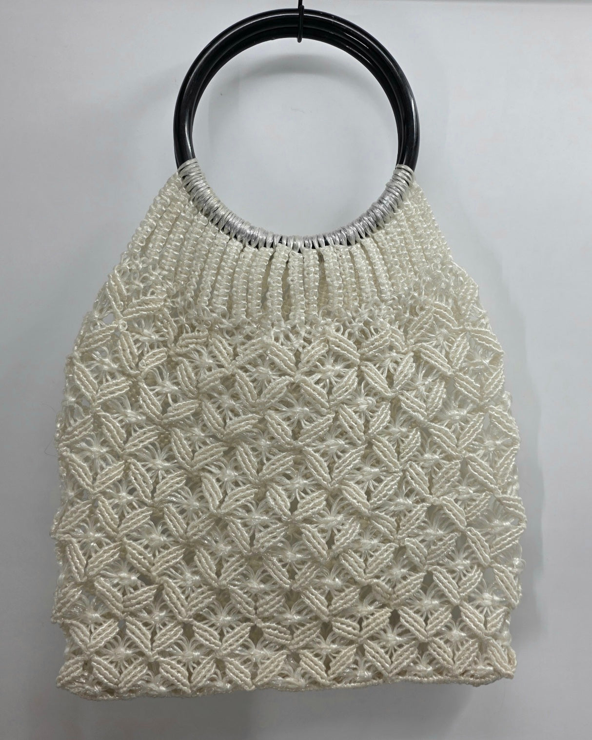 White summer bag crocheted from plastic string, from the 70s