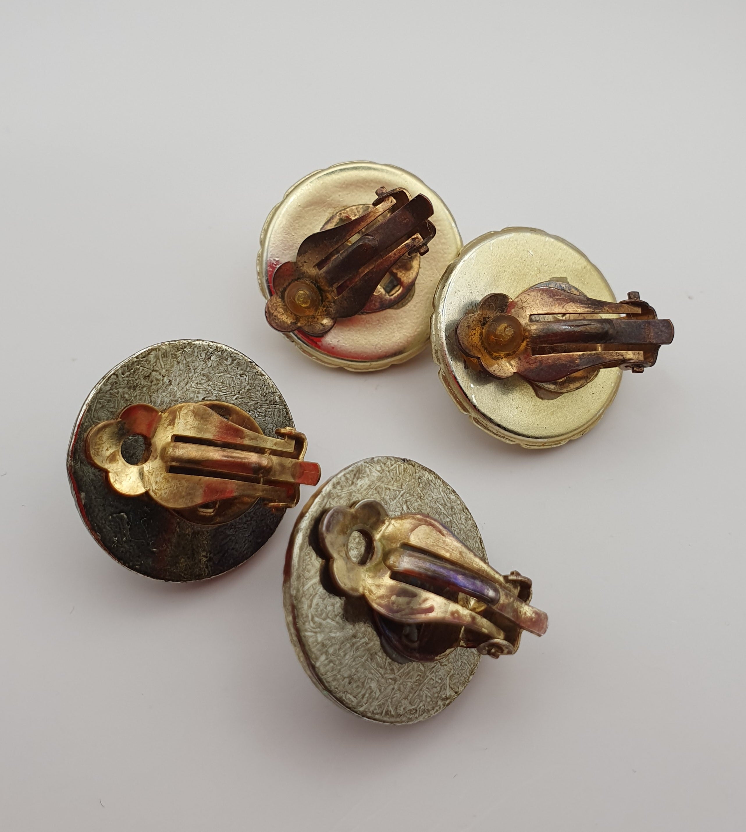Round clip earrings from the 1980s, two different ones